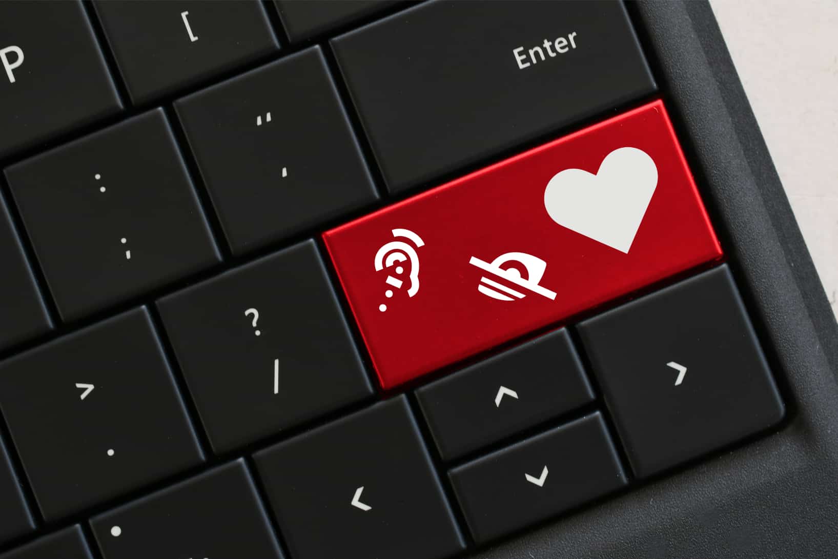 keyboard with disability icons and a heart.